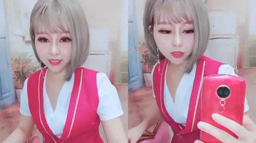 The uniformed girl satisfies fans' requests and spreads her pussy to masturbate and enema
