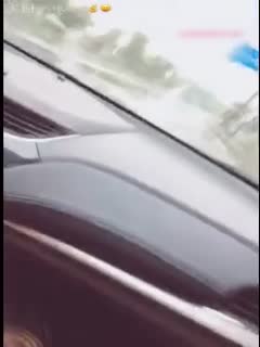 A beautiful young woman has been failing the driving test. She was practicing driving on the road and had sex with her coach. Her husband called her while they were having sex.